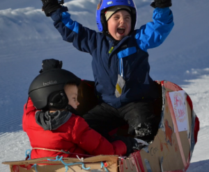 happy child on sled he made